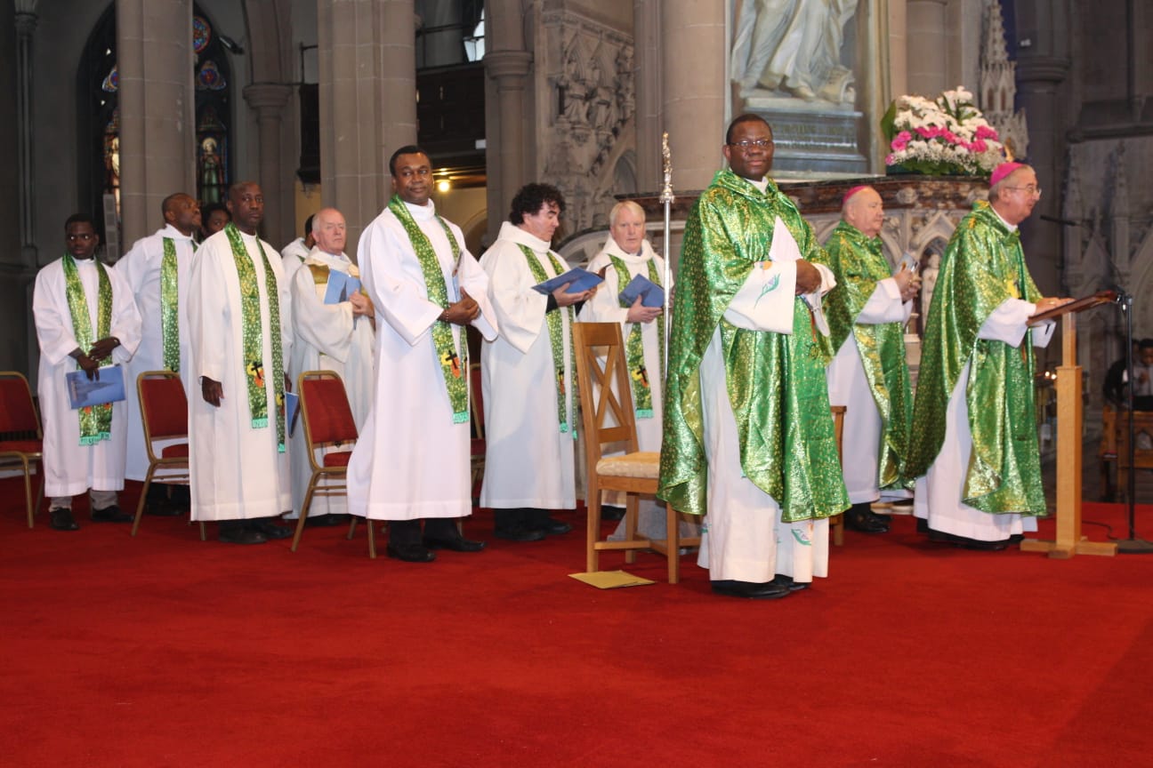 The Archbishop of Dublin Diarmuid Martin, Auxiliary Bishop of Dublin Raymond Field and Chaplain of the African Chaplaincy Fr Cornelius Nwaogwugwu CM are joined by other priests at a celebration of Mass.