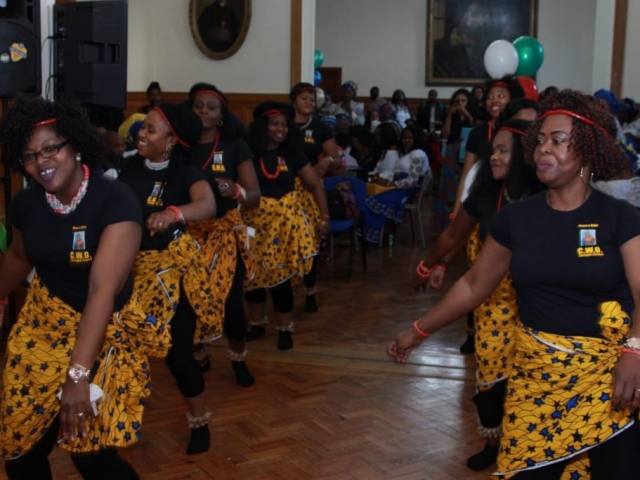 Members of the African Chaplaincy perform a cultural dance